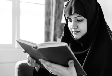 A female teacher teaching holy Quran